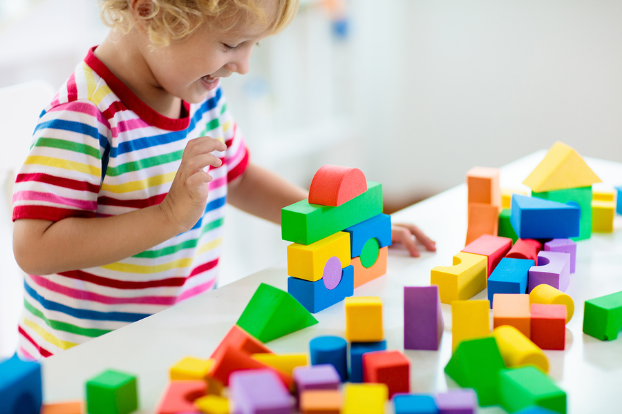 Child playing with blocks, fun activities with toddlers